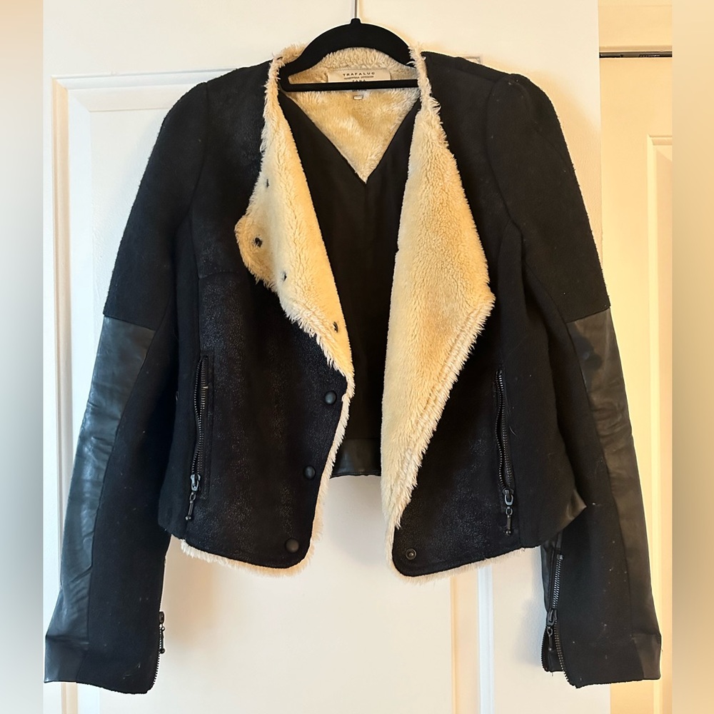 Black jacket with faux leather and fur.